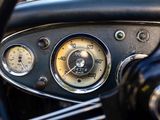 a close up of a car dashboard with a speedometer and gauges