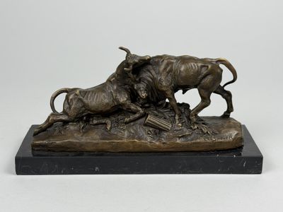 une image représentant une statue en bronze d'un taureau et d'une vache