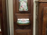 a wooden cabinet with a cushion on top of it in a room