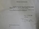 the letter is written on a piece of paper with a picture of a man