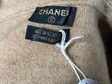 the label on a chanel sweater is attached to the back of the sweater
