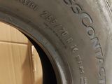 tires are stacked on top of each other in a room