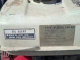 a small engine that is sitting on the side of the road