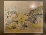 a watercolor painting of a desert scene on display