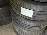 several tires are stacked on top of each other in a garage