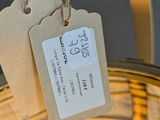 a basket with a tag hanging from it ' s handle