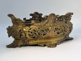 an antique brass planter with ornate design on a white background