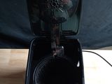 a black box that has a clock inside of it