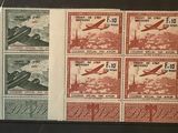 several stamps with a picture of a plane on them on a table