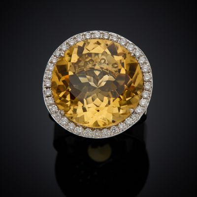an oval citrine and diamond ring