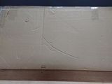 a cardboard box sitting on top of a wooden table