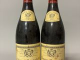 deux bouteilles de vin posées l'une à côté de l'autre sur une table