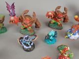 many figurines of different types and sizes on the table
