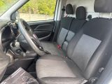 the interior of a car with a steering wheel and seat covers