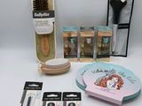 the contents of a beauty kit including a brush, brush, comb, and other items