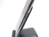 a cell phone that is sitting on top of a stand