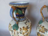 two vases sitting side by side on a table