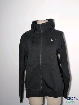 a woman ' s black nike hoodie jacket on a mannequin mannequin mannequin mannequin mannequin mannequin mannequin