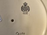 a close up of a white plate with a black and white design on it
