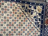 a rug on display on a table in a room