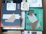 a cardboard box full of electronic devices and other items