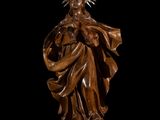 an image of a wooden statue of a woman with a crown on her head