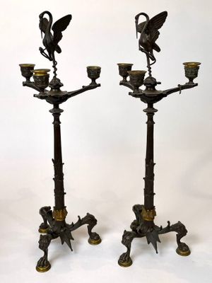 pair of antique bronze candlesticks with birds on them