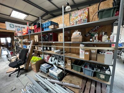 a garage with a lot of tools on the shelves