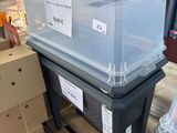 a plastic box that is sitting on top of a pallet