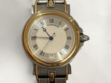 an image of a close up of a wrist watch with roman numerals