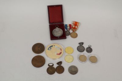 a small box of medals and medals on a table