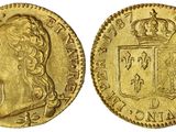 une pièce souveraine en or surmontée d'une couronne