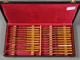 many knives in a case on the table