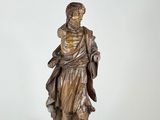statue of a man with a dog on his shoulder