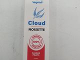 a tube of toothpaste sitting on top of a white table