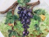 a plate with a bunch of grapes on it