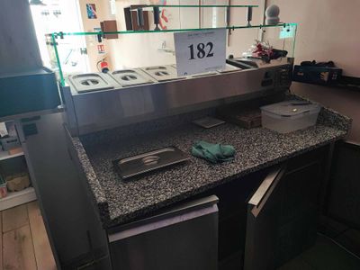 a picture of a counter with a lot of food on it