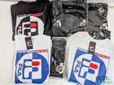 many t - shirts that are sitting on a table