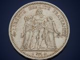 a close up of a coin on a blue background