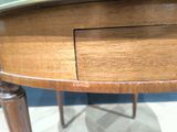 a wooden table with a drawer on top of it