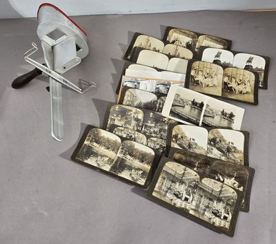 de nombreuses vieilles photos et un coupe-papier sur la table
