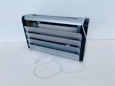 an image of a heater with a cord attached to it