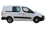 a white van that is parked on the side of the road