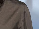 a close up of a man wearing a jacket and tie