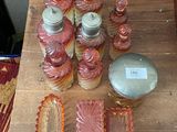 a wooden table topped with jars and containers on it