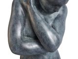 statue of a man holding his head in his hands