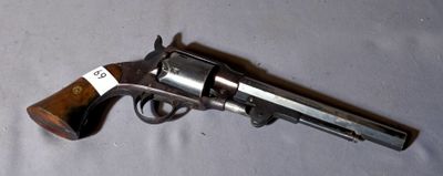 a close up of a gun on a table with a tag on it