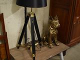 a lamp that is sitting on a table next to a lamp