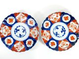 pair of chinese plates with blue and orange designs