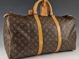 Sac Keepall Louis Vuitton en toile Monogram et cuir
